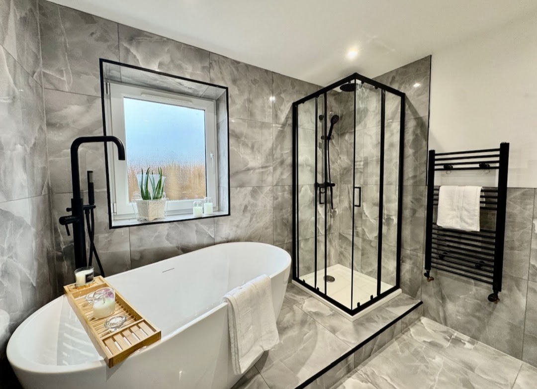 Bathroom with freestanding bath and shower